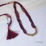 Red stones beads with small gold gundus