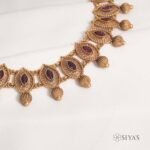 Intricated red stone necklace